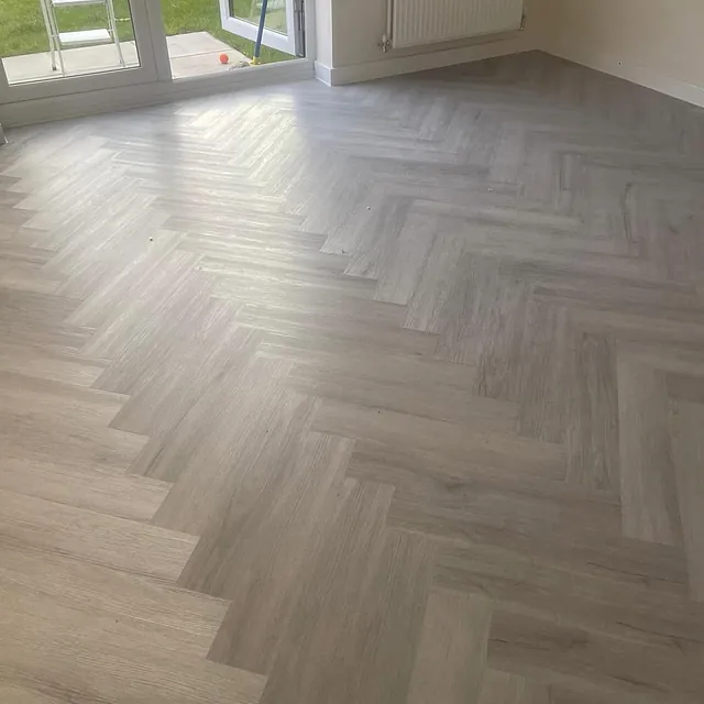 Bonnetto herring bone laminate fitted in Greystone Oak