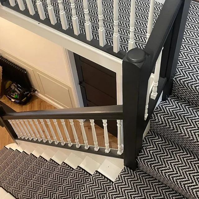 Double set of stairs landing. Runner with black bind for the main staircase and a full Aztec fit for the attic stairs