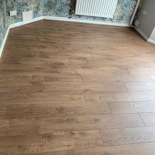 Bedroom fitted in our heavy domestic hardwearing 8mm laminate with colour match beading