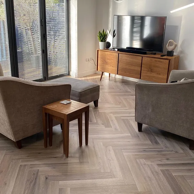 Camaro Naked Blond Oak Herringbone LVT laid in an iconic herring bone pattern giving the look of wood parquet but with the benefits of a Polyflor vinyl floor