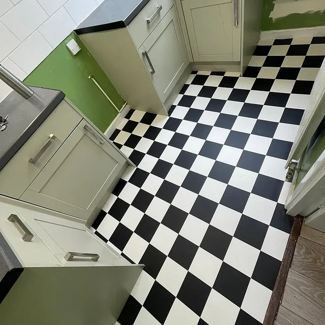 Chequer board cushion - floor vinyl in kitchen