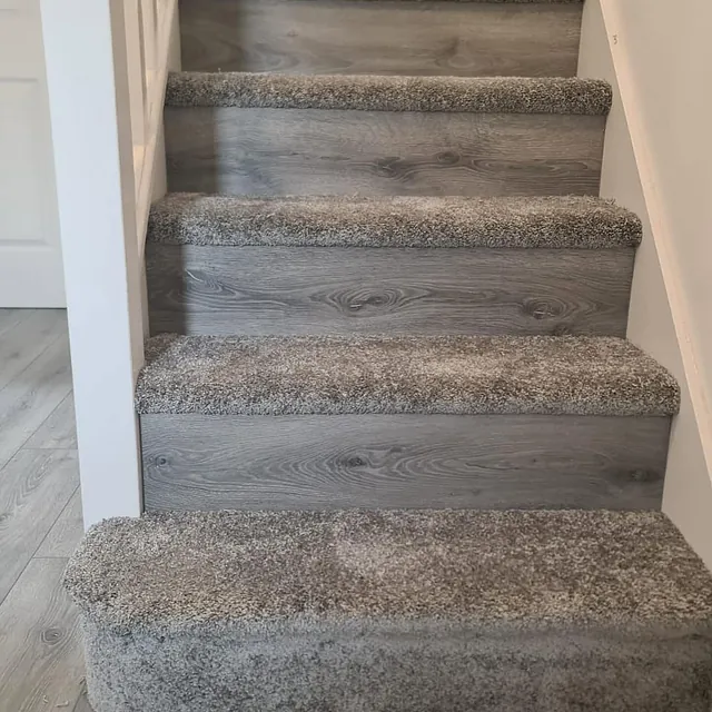 Classic grey - Heavy duty stain resistant carpet treads teamed with a mid grey laminate throughout