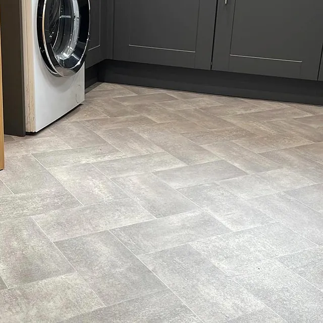 A blonde oak herring bone cushion floor