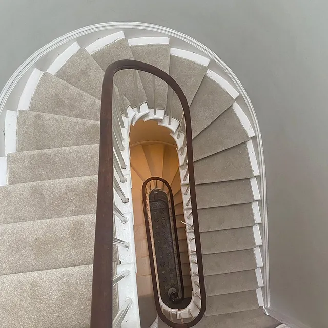 Puerto Rico soft stain resistant carpet bound and fitted as a runner for both sets of winding staircases
