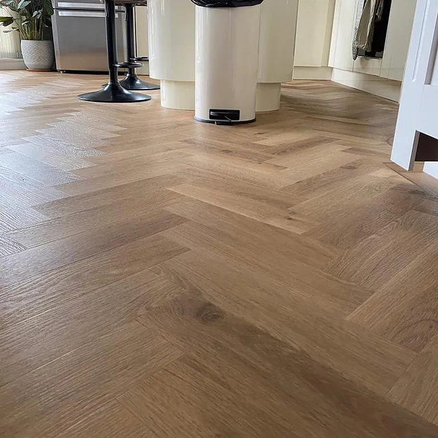 Invictus classic oak is a timeless colour fitted in a modern herringbone pattern fitted throughout