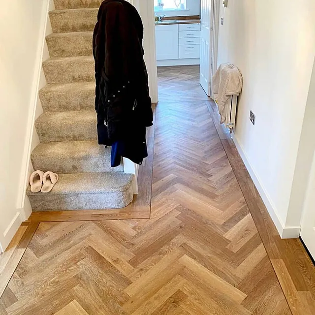 Luxury vinyl tile throughout finished with a feature strip