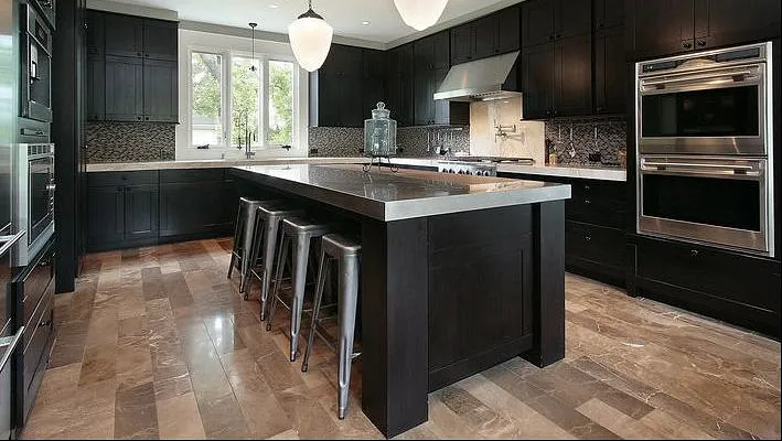 A modern kitchen with laminate flooring