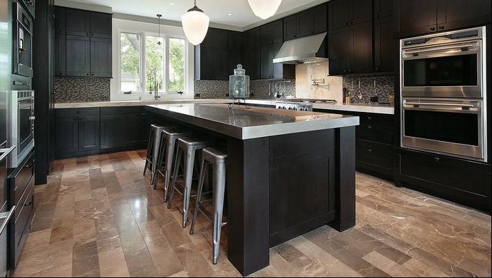 A modern kitchen with laminate flooring
